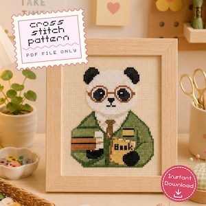 May include: A cross stitch pattern PDF file featuring a panda wearing round glasses and a green sweater, holding a book. The panda has black ears and eye patches, a white face, and a brown tie. The text 'cross stitch pattern PDF FILE ONLY' is visible.