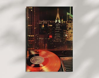 May include: A vintage-style print featuring a cityscape at night, with a vinyl record player in the foreground. The record is a warm orange color, and the city lights create a vibrant backdrop. The Chrysler Building is visible.