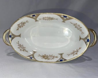 Tigela oval vintage Nippon pintada à mão com detalhes texturizados em dourado.
