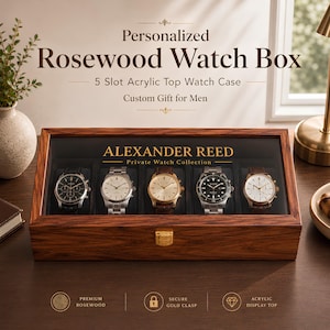 May include: A rectangular rosewood watch box with a clear acrylic top, featuring five interior slots each containing a wristwatch. The lid displays the text "ALEXANDER REED Private Watch Collection" in gold lettering and includes a gold metal clasp.