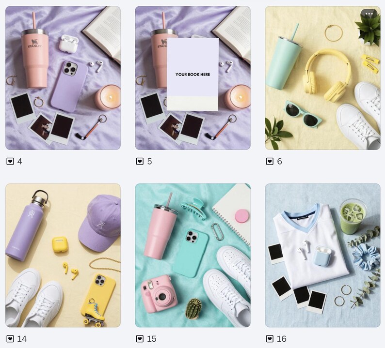 May include: A collection of items including a light pink tumbler, a purple phone case, white wireless earbuds, a candle, two blank polaroid-style frames, a gold ring, a keychain, and an open book on a light purple fabric surface.