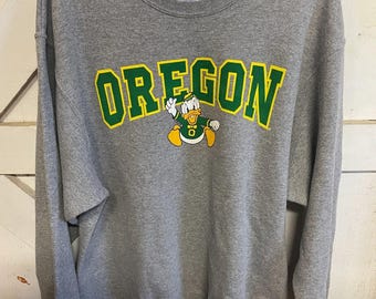 Sudadera vintage Oregon Champion talla L con cuello redondo Jeerzes, color gris.