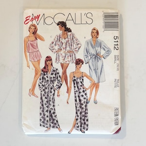 May include: A McCall's 5112 sewing pattern envelope for sleepwear, featuring illustrations of five different garments including robes, a camisole, shorts, and a nightgown. The text includes Easy McCall's, 5112, Size Small (10, 12), and Taille Petite.