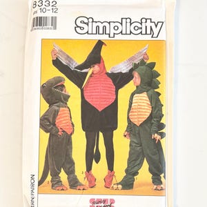 May include: A Simplicity sewing pattern envelope 8332 for children's sizes 10-12, featuring illustrations of three dinosaur costumes. The costumes include a dark green dinosaur, a black and red pterodactyl with silver wings, and a green dinosaur with spikes.