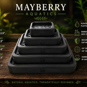 May include: A stack of five black rectangular floating platforms by Mayberry Aquatics, ranging from Nano 3" x 2.5" to XL 6" x 7". Each platform features drainage holes and a small logo. Text includes "Floating humidity platform" and "Secure suction cup mounting."