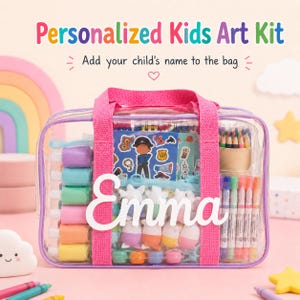 May include: A clear plastic carrying case with pink fabric handles and trim, featuring the name Emma in white script. Inside are colorful paint bottles, markers, colored pencils, stickers, and small figurines, all visible through the transparent material.