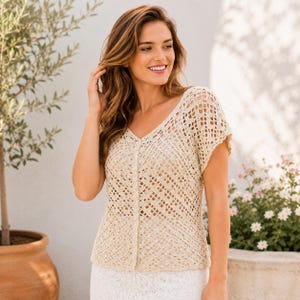 May include: A beige short-sleeved cardigan featuring an open-work crochet pattern with a V-neckline and a vertical row of matching buttons down the center front. The garment is constructed with a lightweight, textured knit fabric.