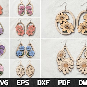 May include: A collection of laser-cut wooden earrings featuring various floral designs in shades of pink, purple, orange, and blue. The earrings are displayed in pairs with different geometric frames including teardrops, ovals, and diamonds.