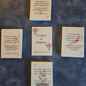 May include: Five white rectangular cards arranged in a cross pattern. The center card reads A Legacy of Kindness. The surrounding cards feature numbered tasks and quotes, including The Unexpected Note, The Quiet Boundary, The Passing Praise, and The Wild Offering, decorated with small illustrations of trees, birds, and plants.