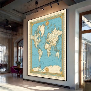May include: A large rectangular wall art print featuring a vintage-style world map with cream-colored landmasses against a light blue ocean background. The map is enclosed in a decorative gold border with compass roses at the top and bottom.