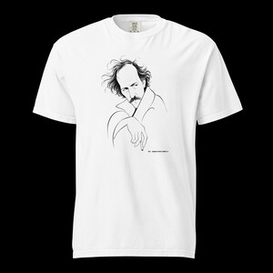 May include: White t-shirt featuring a black and white line drawing of a man with a mustache and long hair. The drawing is a portrait of a man with his hand resting on his chin. The text "PIC - DIRECTORS ROOM" is printed below the drawing.