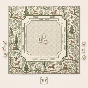 May include: A square mahjong mat featuring a cream-colored center with a repeating cross pattern and green text instructions. The border displays a green and cream forest scene with animals. Three mahjong tiles sit in the center, with six more tiles placed outside the mat.