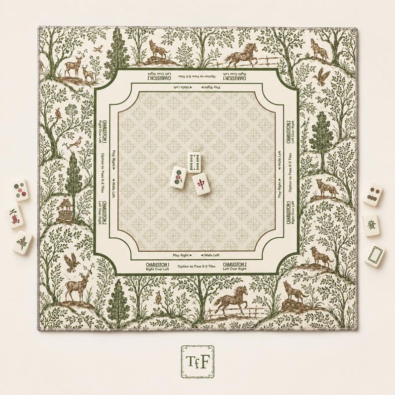 May include: A square mahjong mat featuring a cream-colored center with a repeating cross pattern and green text instructions. The border displays a green and cream forest scene with animals. Three mahjong tiles sit in the center, with six more tiles placed outside the mat.