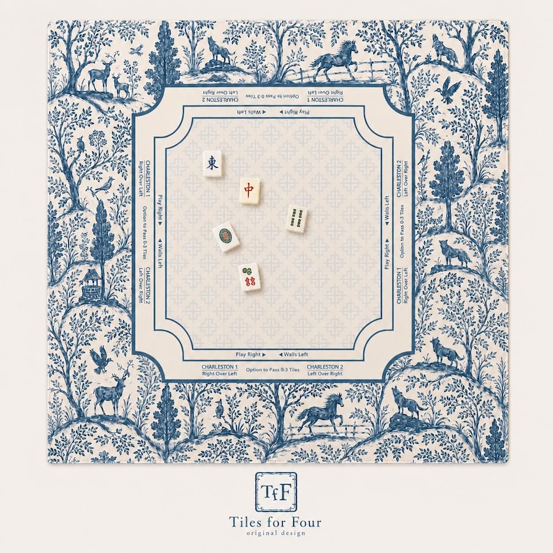 May include: A square Mahjong mat featuring a blue and cream toile de jouy pattern with forest animals and trees. The centre area includes game instructions and directional text, with five Mahjong tiles scattered across the surface.