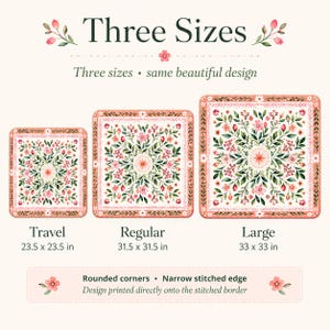 May include: Three square mats with a floral pattern featuring pink flowers and green leaves. The text reads Three Sizes, Travel 23.5 x 23.5 in, Regular 31.5 x 31.5 in, and Large 33 x 33 in. Features include rounded corners and a narrow stitched edge.