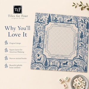 May include: A square American Mahjong mat featuring a blue and white toile pattern of trees and animals. The center includes printed game instructions and directional markers. A small bowl with white Mahjong tiles sits nearby on the surface.