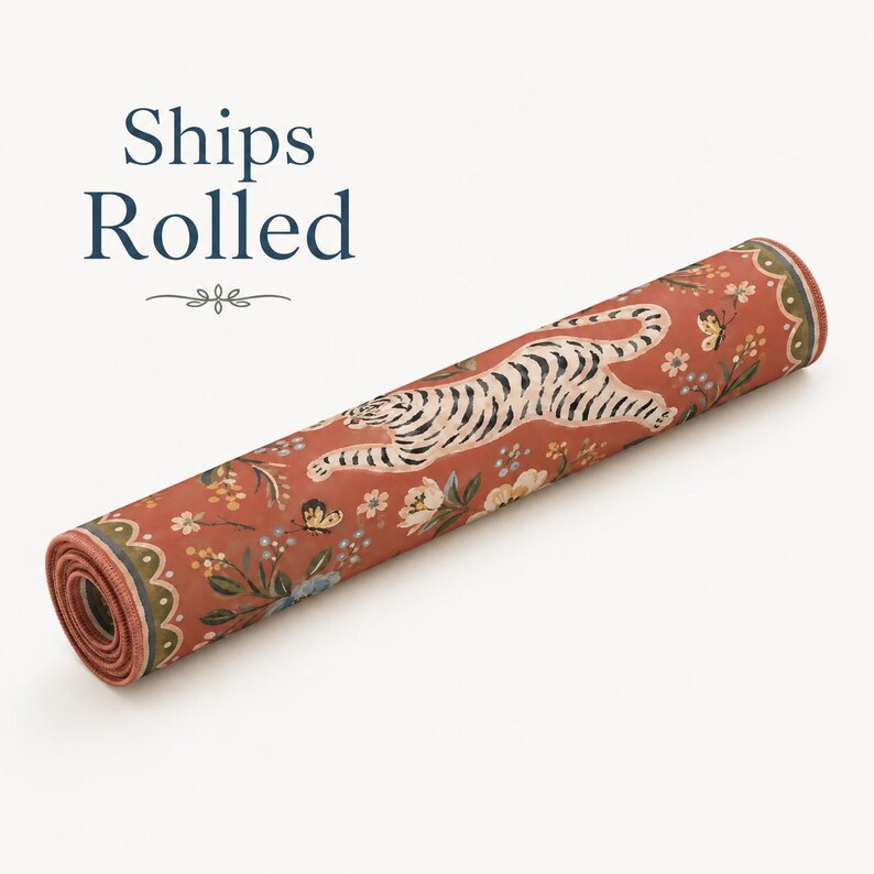 May include: A rolled mat featuring a terracotta orange background with a repeating pattern of white tigers, yellow butterflies, and small floral sprigs. The edges are finished with a scalloped border in shades of green, cream, and dark brown.