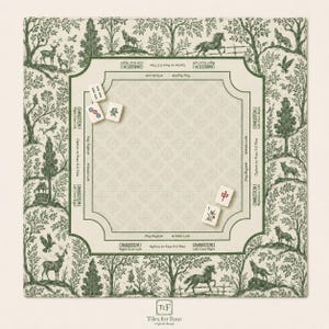 May include: A square game mat featuring a green and cream toile-style forest pattern with animals and trees. The center includes printed instructions for Charleston gameplay, with four mahjong tiles placed on the surface. The text reads Tiles for Four.