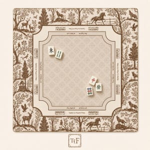 May include: A square Mahjong mat featuring a cream-coloured centre with a repeating cross pattern and brown border text detailing Charleston rules. The outer edge displays a brown and cream toile-style forest scene with animals. Four Mahjong tiles are placed on the mat.