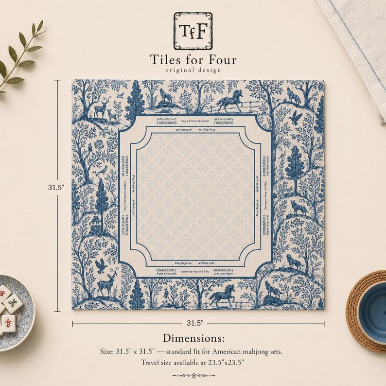 May include: A square mahjong mat measuring 31.5 inches by 31.5 inches, featuring a blue and white toile-style forest pattern with animals. The center has a beige square with game instructions and directional text for Charleston play.