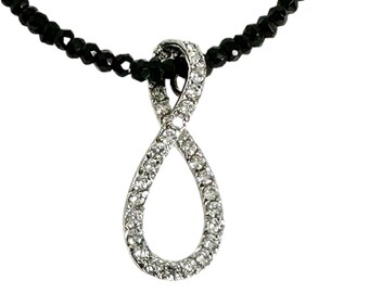 Black Onyx Faceted Bead Necklace Supporting a Sterling Silver and Cubic Zirconia Pendant