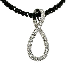 Black Onyx Faceted Bead Necklace Supporting a Sterling Silver and Cubic Zirconia Pendant