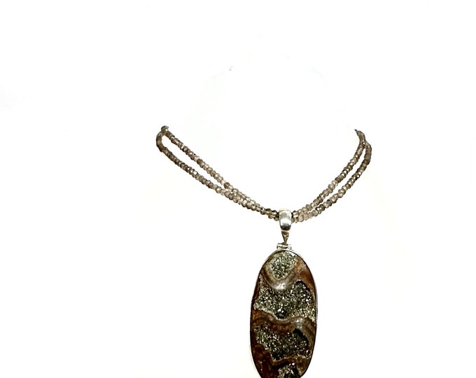 Large Ammonite set in Sterling Silver Frame,  Supported by a Smokey Quartz Necklace