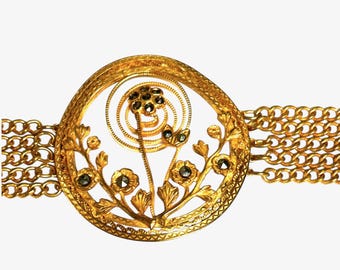 Gold Tone Marcasite Chain Bracelet with Center Flower Design and Scroll Design Clasp