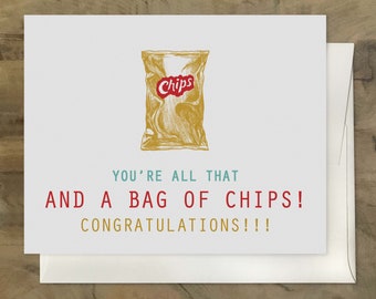 May include: A white card with a drawing of a bag of chips with the word "Chips" in red on the bag. The text on the card reads "You're all that and a bag of chips! Congratulations!!!"