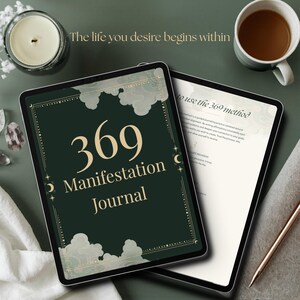 May include: A digital tablet displaying a dark green 369 Manifestation Journal cover with gold text and cloud graphics, alongside a second tablet showing instructions for the 369 method, a candle, a coffee mug, and a metallic pen.