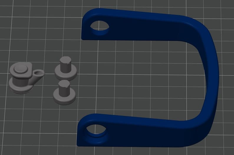 May include: A dark blue U-shaped bracket with circular holes at each end, accompanied by two small gray cylindrical pegs and one gray component featuring a circular base, a raised center, and a small angled protrusion extending from the side.