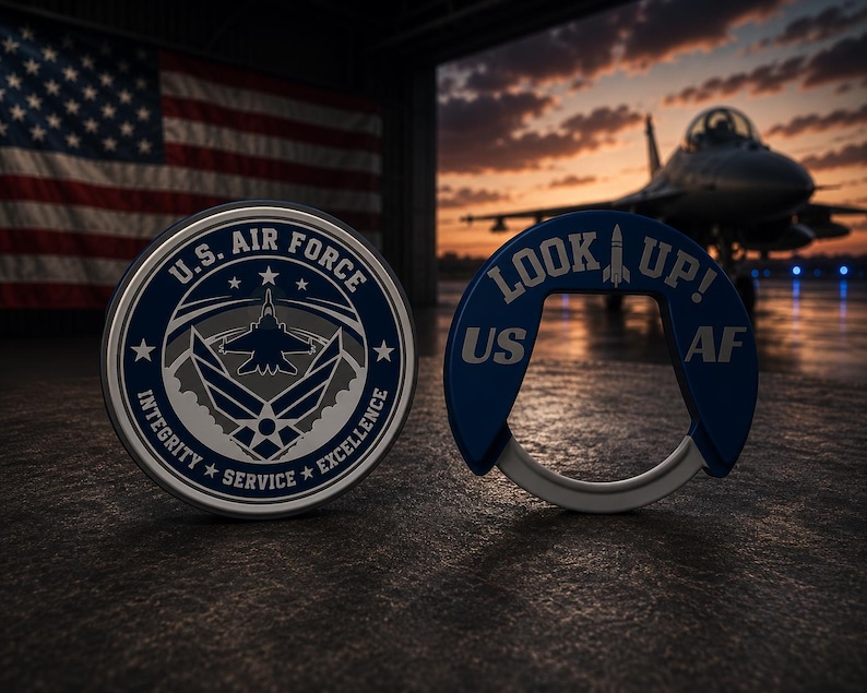 May include: A circular U.S. Air Force challenge coin featuring the official emblem and the text Integrity, Service, Excellence, alongside a blue U-shaped bottle opener with the text Look Up! and US AF, both displayed against a hangar background.