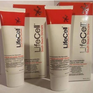 May include: Two white and red tubes of LifeCell South Beach Skincare all-in-one anti-aging treatment alongside two matching rectangular boxes. Each container features black text detailing clinical skin care benefits and a net weight of 2.54 oz.