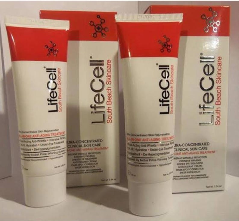 May include: Two white and red tubes of LifeCell South Beach Skincare all-in-one anti-aging treatment alongside two matching rectangular boxes. Each container features black text detailing clinical skin care benefits and a net weight of 2.54 oz.