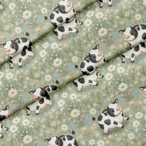 May include: A fabric pattern featuring a repeating illustration of black and white spotted cows in a field of green grass, white daisies, and small blue flowers. The cows are depicted in various positions, including sitting and standing, across the surface.