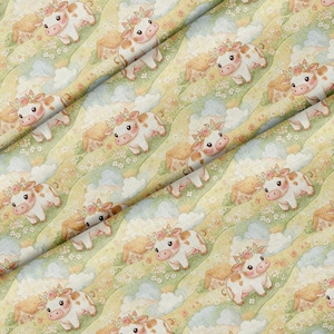 May include: A fabric featuring a repeating pattern of cartoon cows with flower crowns, set against a background of rolling green hills, small houses, and white clouds. The cows are white with brown spots and have pink ears and noses.