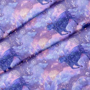 May include: Fabric featuring a repeating pattern of dark blue winged bulls against a purple and pink nebula background. The design includes white dandelion seed heads, scattered glowing stars, and soft cloud-like textures across the surface.
