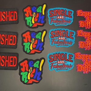 May include: A collection of twelve embroidered patches arranged in four columns and three rows. The patches feature the text POLISHED in red, Real Rich with a dollar sign, SINGLE AND Fabulous in blue and red, and Expensive And Difficult in pink.