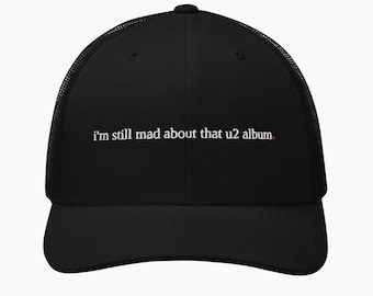 i'm still mad about that u2 album. - funny music trucker hat