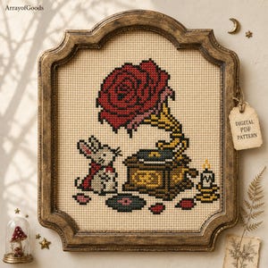 May include: A cross-stitch pattern featuring a white mouse wearing a red cape, a vintage gramophone with a large red rose as the horn, a black vinyl record, and a lit candle. The design is displayed in an ornate, antique gold-toned frame.
