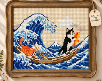 May include: A cross-stitch pattern in a vintage-style frame featuring a stylized ocean wave, a mountain, and two cats in a boat. One cat is orange, the other is black and white holding a gold fish. A tag reads DIGITAL PDF PATTERN.