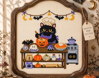 May include: A cross-stitch pattern in a dark wooden frame featuring a black cat wearing a chef hat and purple apron, stirring a pumpkin bowl. The scene includes a stove, baking supplies, pumpkins, and a banner with bats and moons. A tag reads DIGITAL PDF PATTERN.