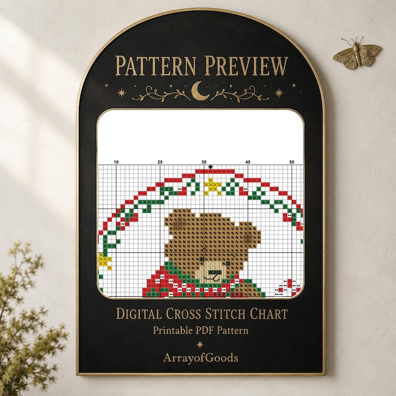 May include: A digital cross stitch chart featuring a brown teddy bear wearing a red and green patterned sweater under a festive arch. The black arched frame displays the text PATTERN PREVIEW, DIGITAL CROSS STITCH CHART, and ArrayofGoods.