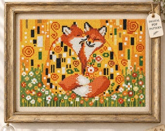 May include: A cross-stitch embroidery pattern featuring two foxes embracing, rendered in shades of orange, yellow, and white. The design includes floral accents and geometric patterns, framed in a rustic gold frame with a tag labeled DIGITAL PDF PATTERN.