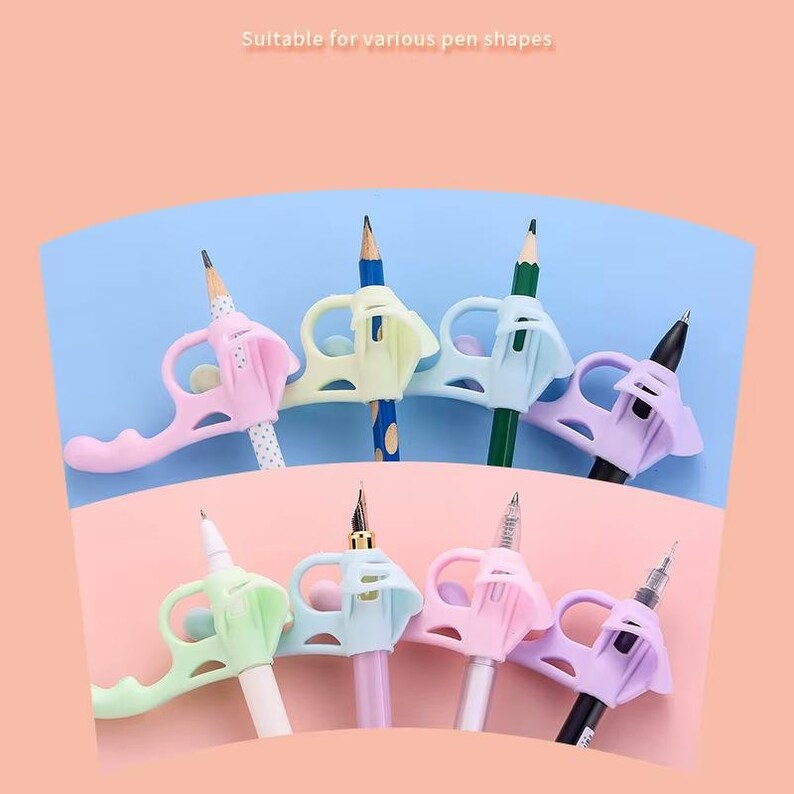 May include: A collection of eight ergonomic silicone pen grips in pastel shades of pink, blue, green, and purple. Each grip features a finger loop and a central opening to hold various writing instruments, including pencils, fountain pens, and ballpoint pens.