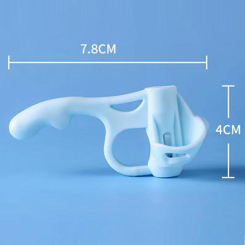 May include: A light blue plastic ergonomic handle attachment for a spray bottle. The device features a trigger-like grip and a circular collar for mounting. It measures 7.8 cm in width and 4 cm in height as indicated by the visible dimension lines.