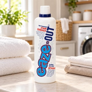 May include: A white plastic bottle of Eaze-Out super concentrated stain remover with a blue cap. The label features the text Eaze-Out in large blue letters with a red outline, along with descriptive text about its ability to lift set-in stains.