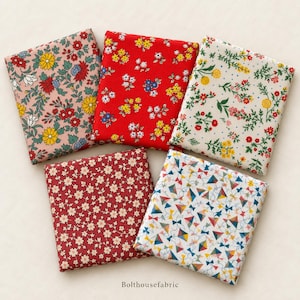 May include: Five folded fabric squares featuring diverse patterns: a pink floral print, a red floral print, a cream floral print, a dark red small flower print, and a white geometric kite print. The text Bolthousefabric is printed at the bottom.