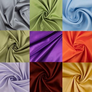 May include: A grid of nine fabric swatches featuring a smooth, satin-like finish. The colors include gray, light green, light blue, olive green, purple, orange, lavender, deep burgundy, and gold, all arranged in a three-by-three square pattern.