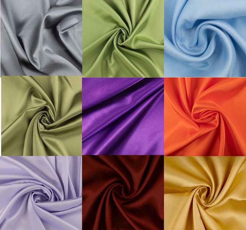 May include: A grid of nine fabric swatches featuring a smooth, satin-like finish. The colors include gray, light green, light blue, olive green, purple, orange, lavender, deep burgundy, and gold, all arranged in a three-by-three square pattern.